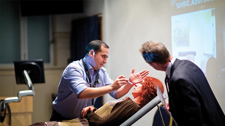 A doctor diagnosing a patient