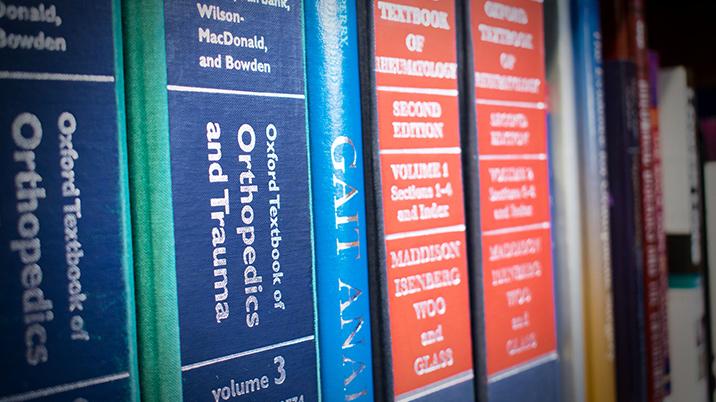 Books stacked together on a shelf